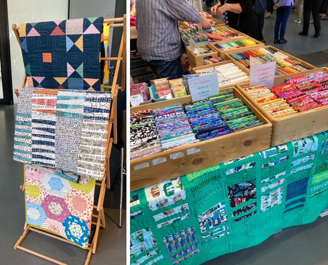 Der Stand von "Quilt Cabin" mit bunten Stoffen und Quilten auf der Nadelwelt in Karlsruhe 2026